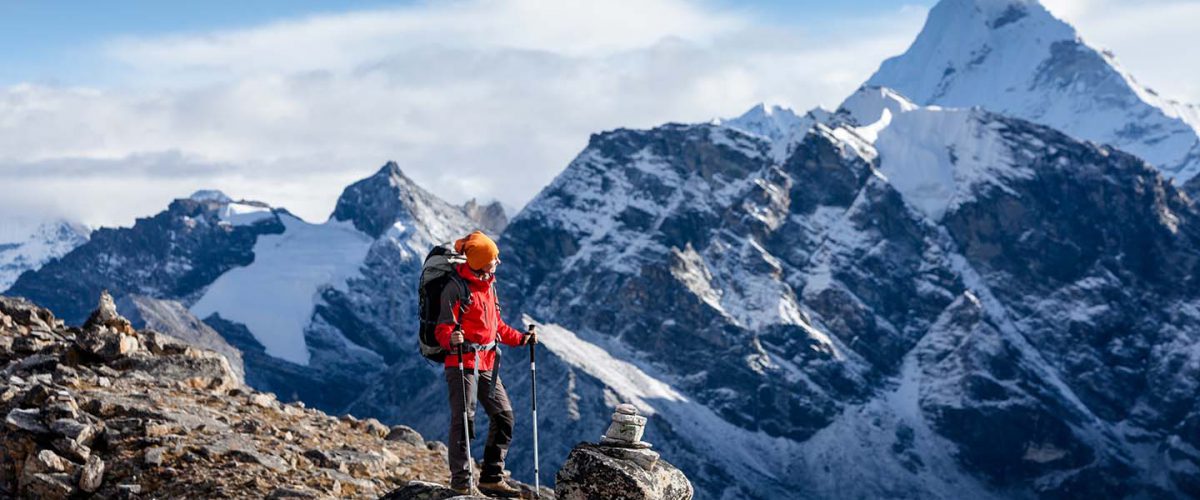 Hiker posing at camera on the trek in Himalayas, Nepal