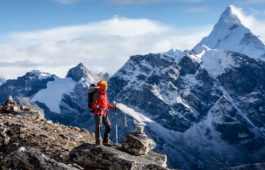 Hiker posing at camera on the trek in Himalayas, Nepal