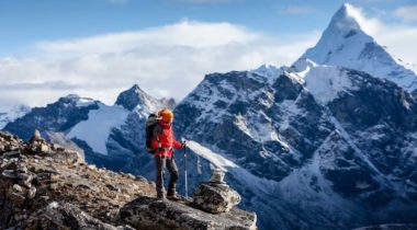 Hiker posing at camera on the trek in Himalayas, Nepal